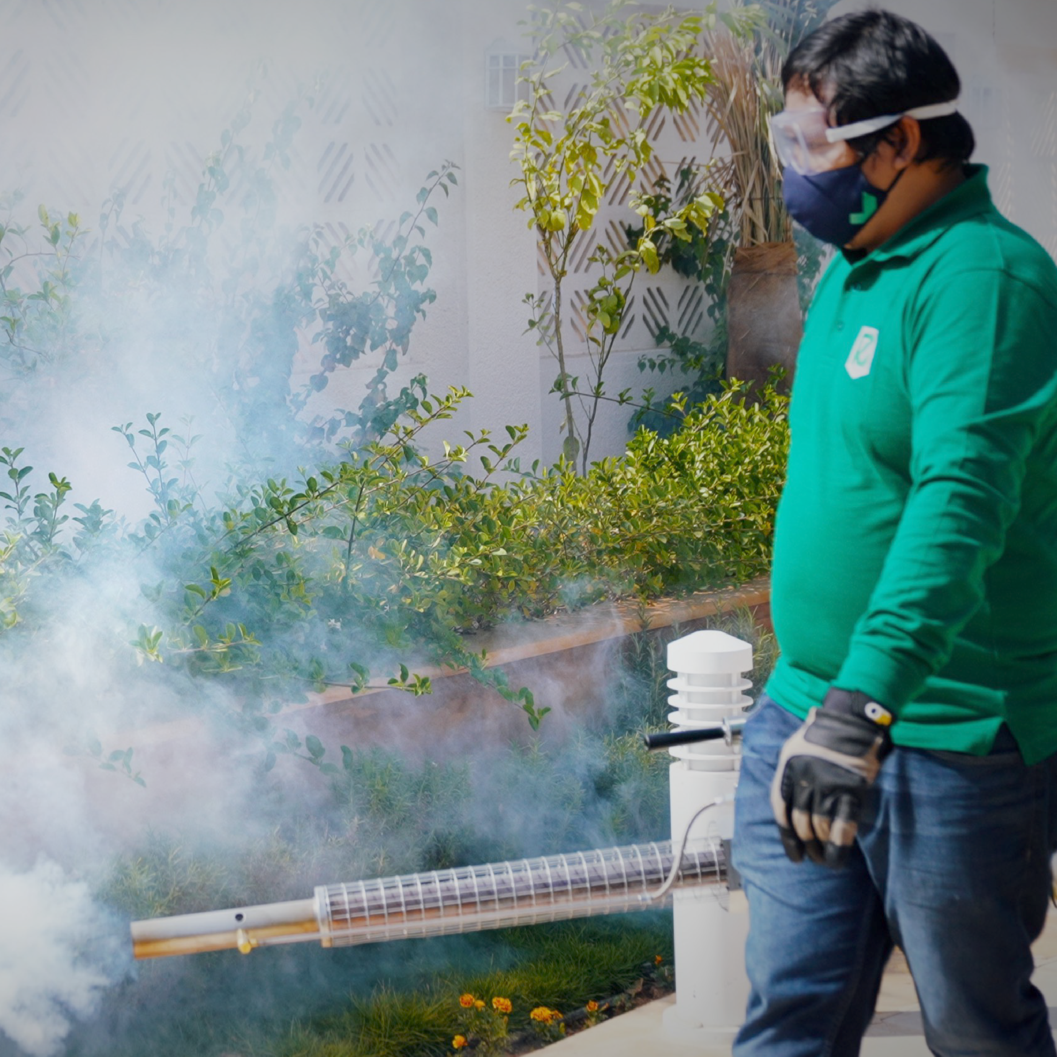 Rush technician treating a garden perimeter